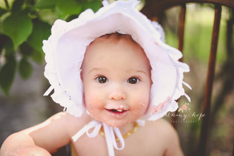 I think every cake smash should require an old high chair and a bonnet. I should do these outside more often!! <3 