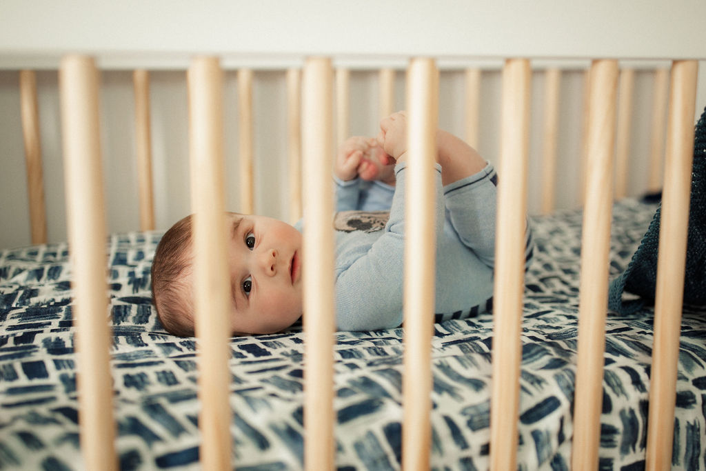 4 month old in a crib 