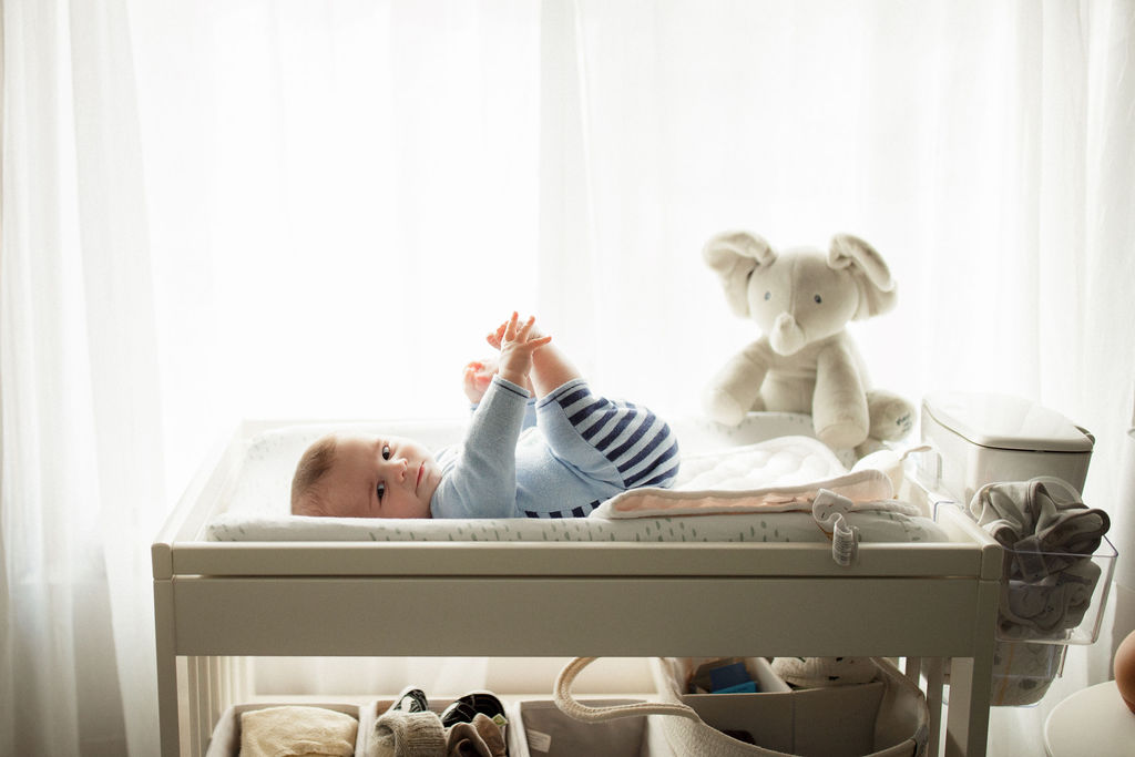 baby on changing table