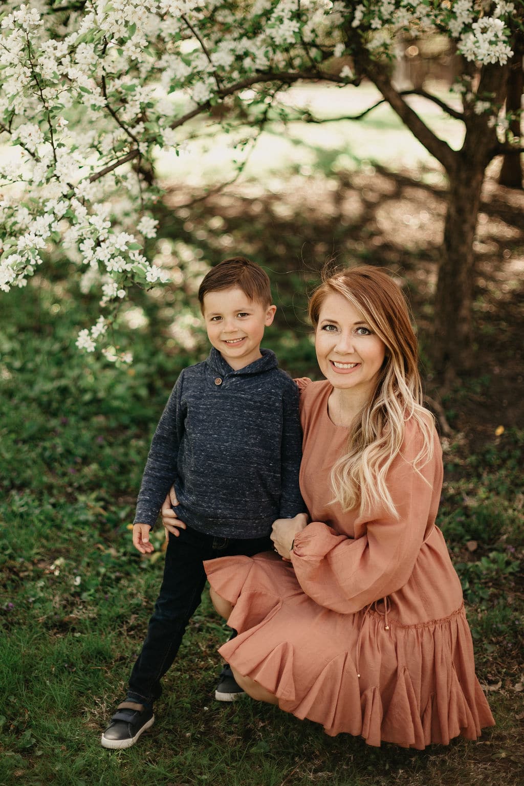 sweet boy with his mom at outdoor family photo session 