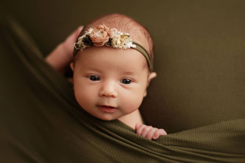 adorable infant girl in green