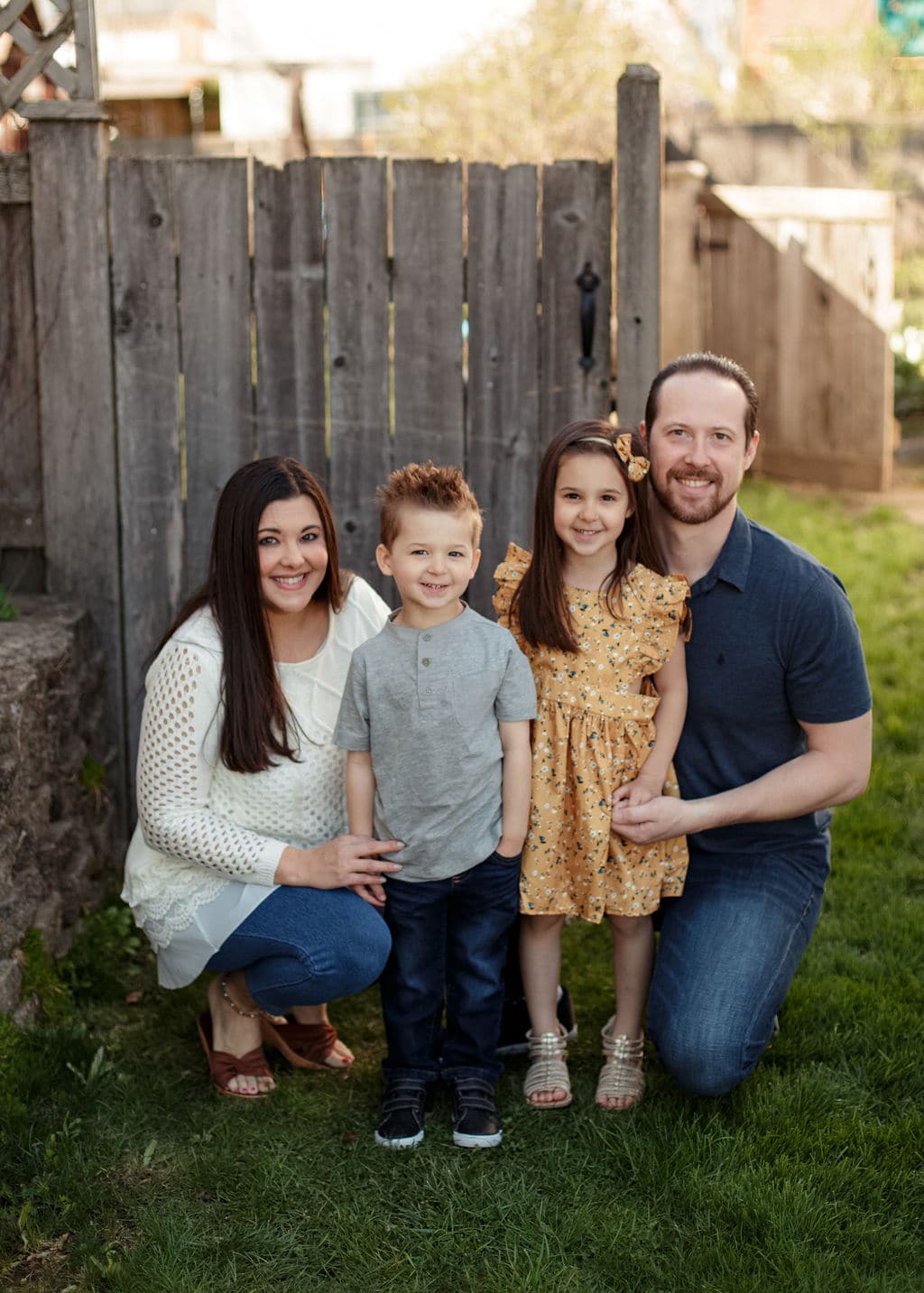 family in their yard for a photo shoot 