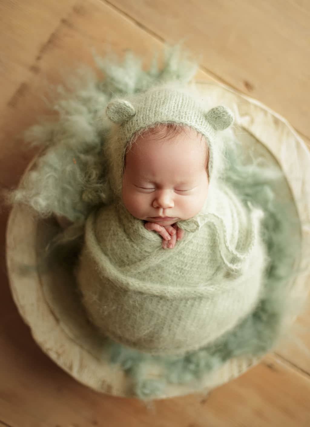 newborn girl in greens