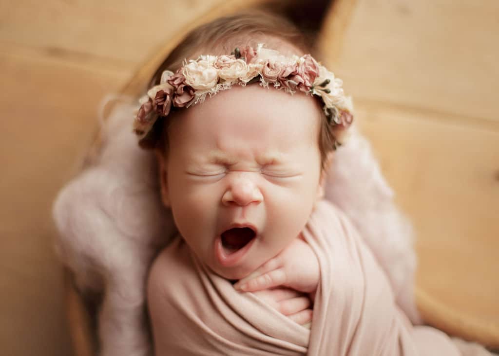 baby girl sleeping and yawning