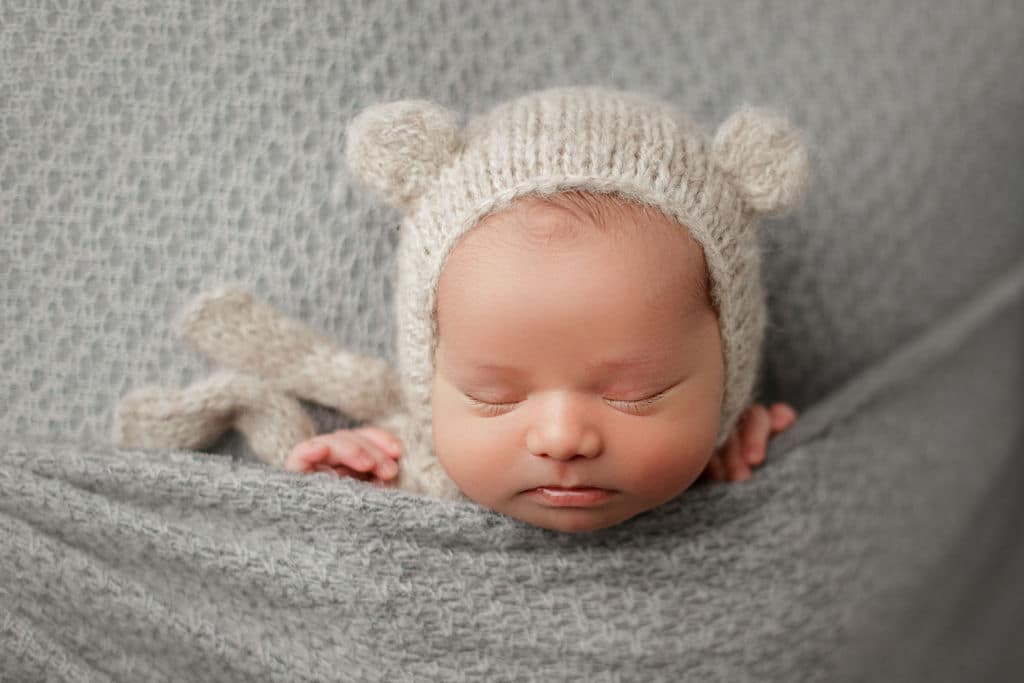 baby boy in bear hat