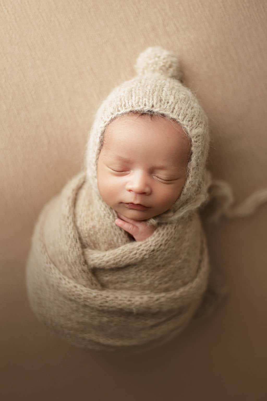 swaddled newborn baby boy