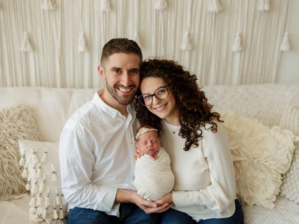 adorable new family in vintage newborn studio