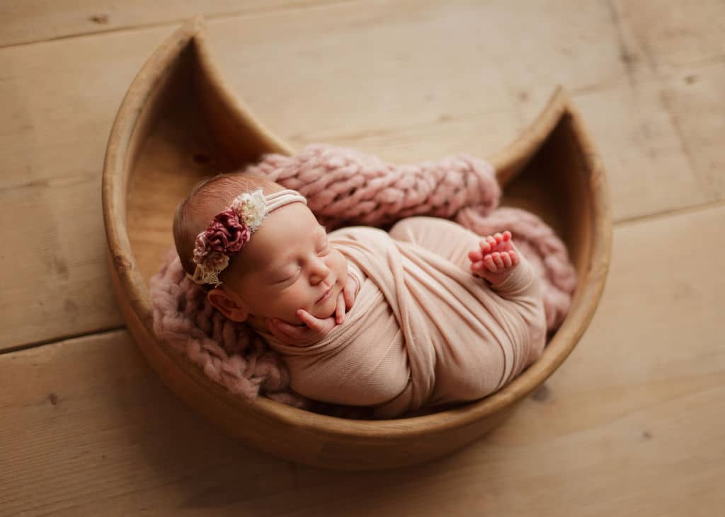 newborn baby in moon basket