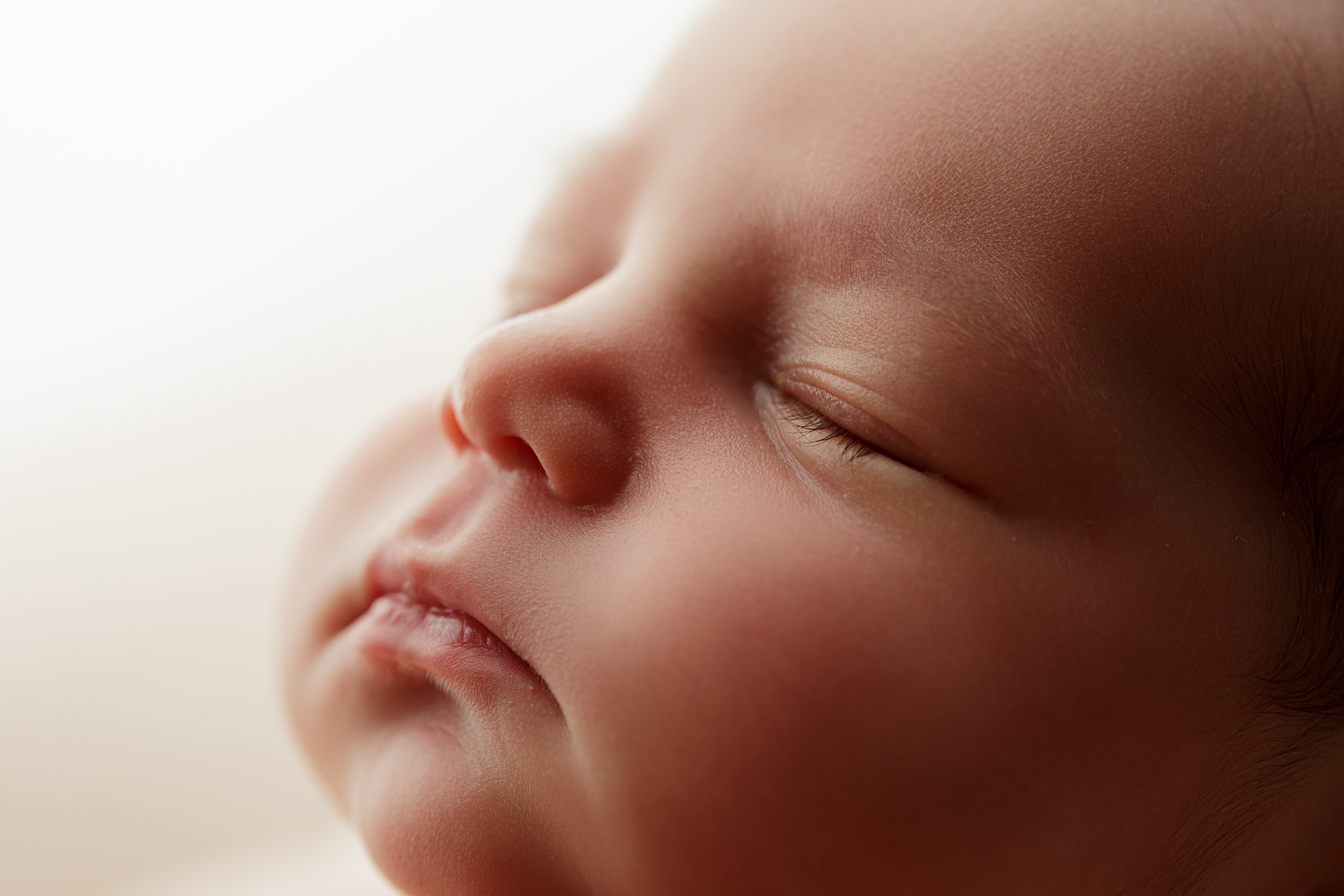 close up newborn girl's face