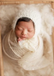 swaddled newborn baby girl