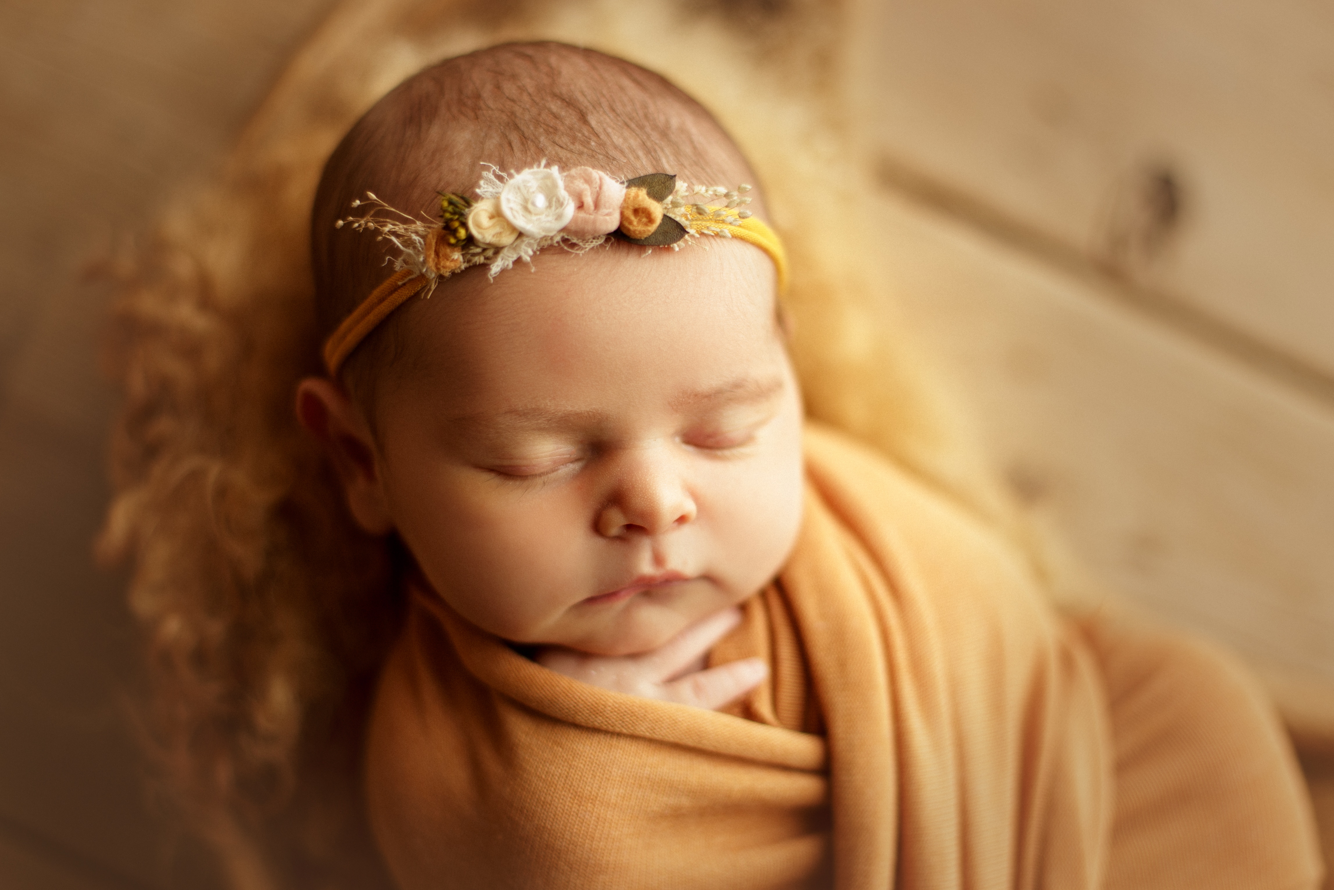 newborn girl in yellows