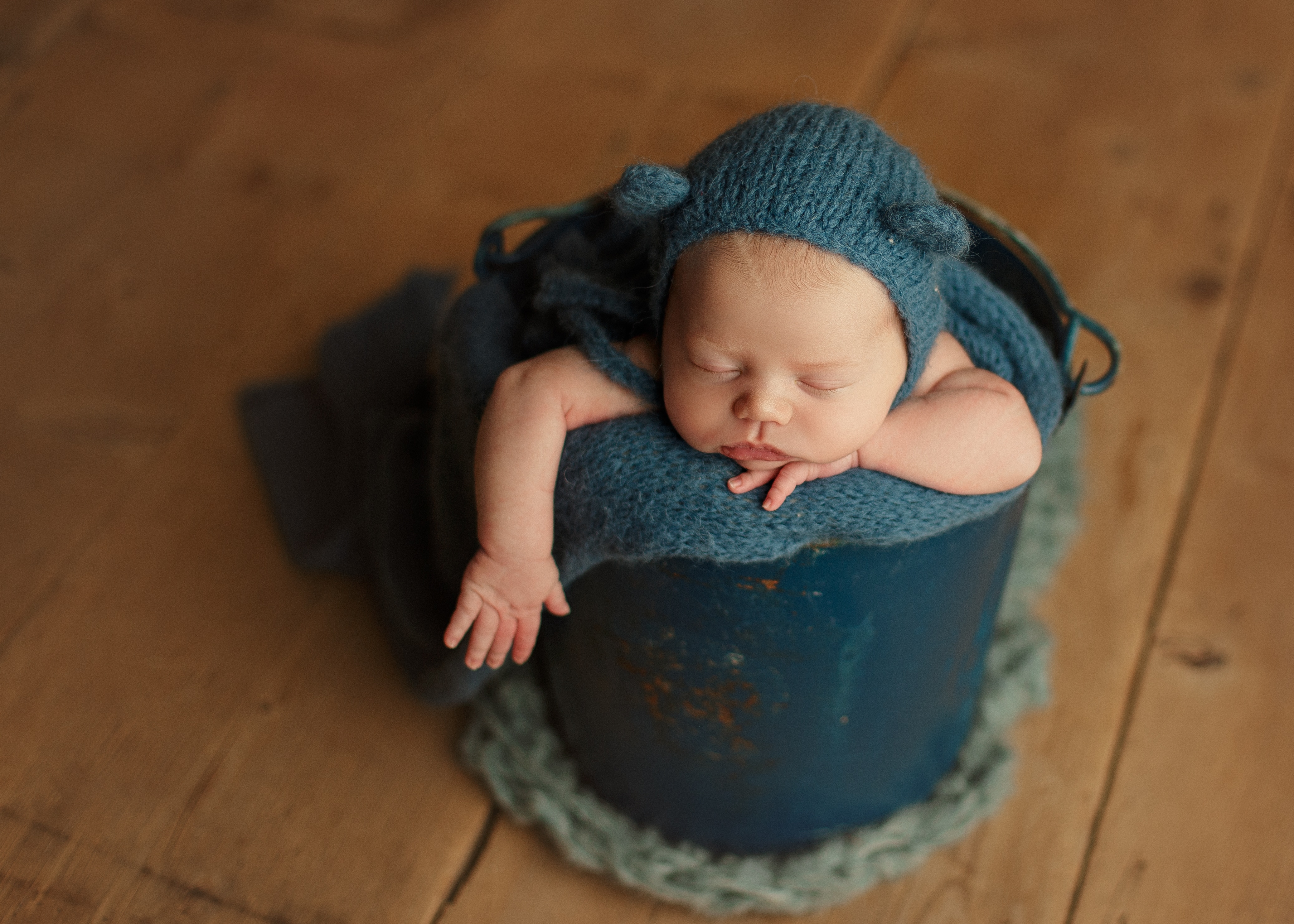 baby boy in blue bucket