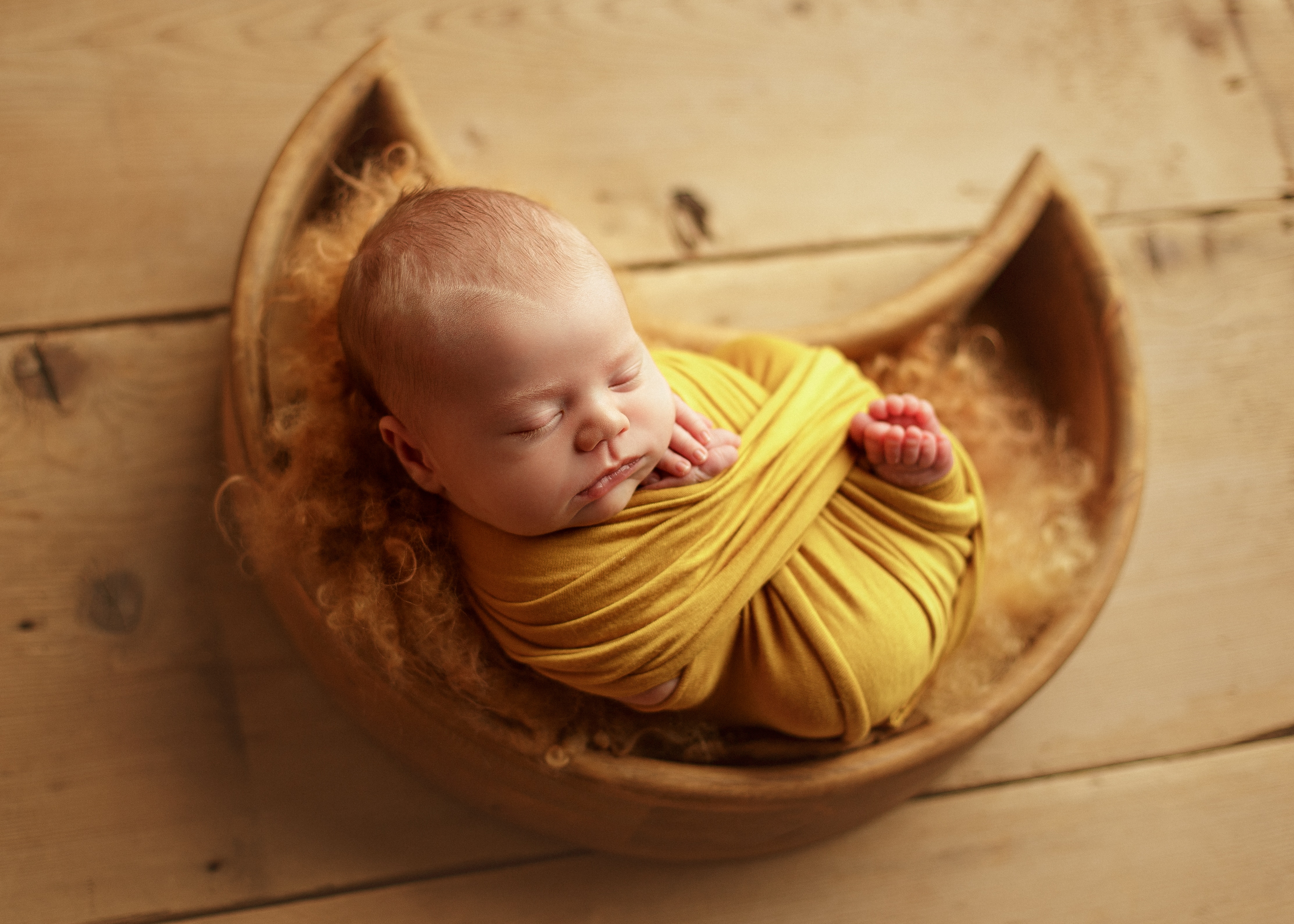 newborn boy in moon basket