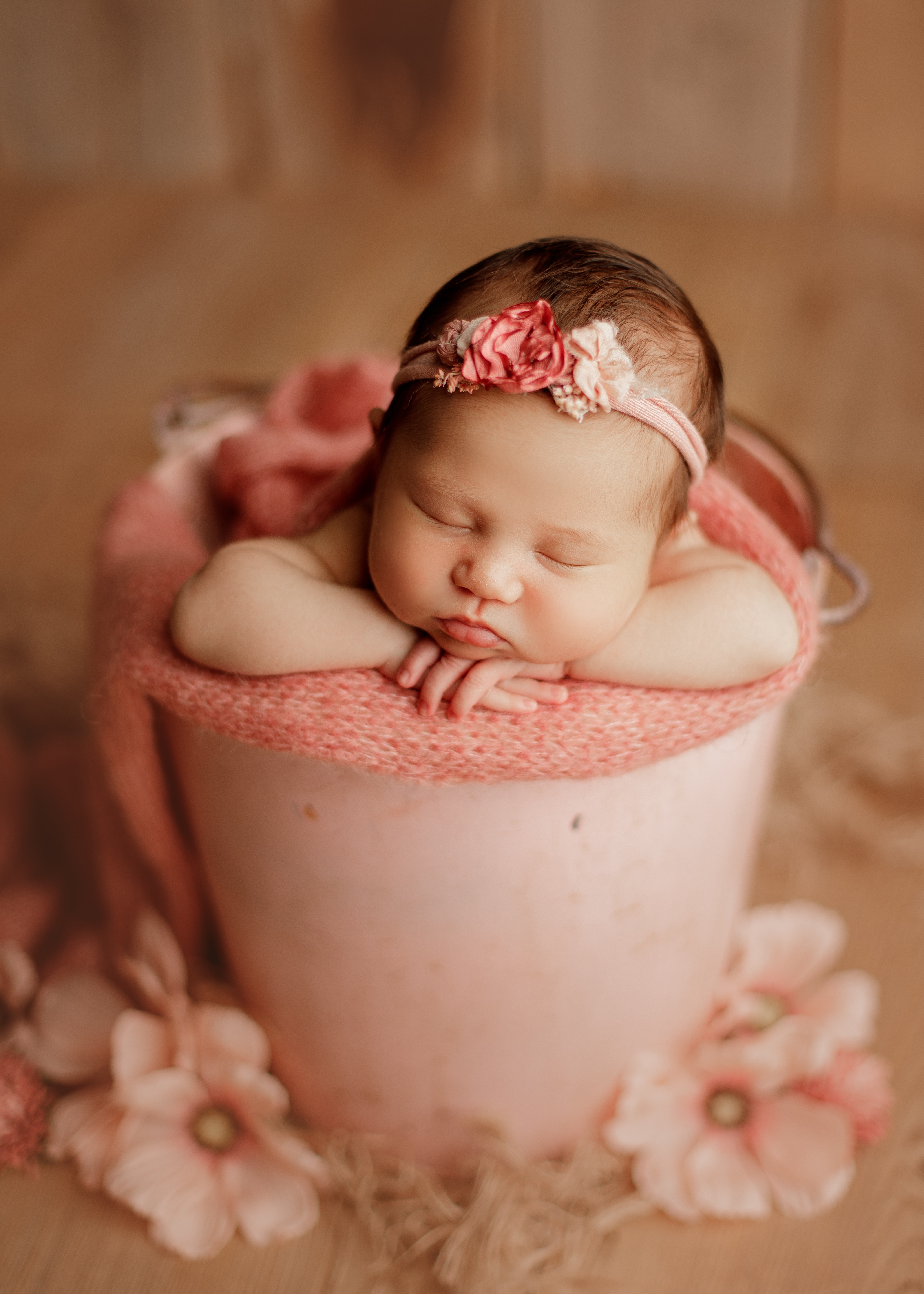 newborn baby girl in bucket