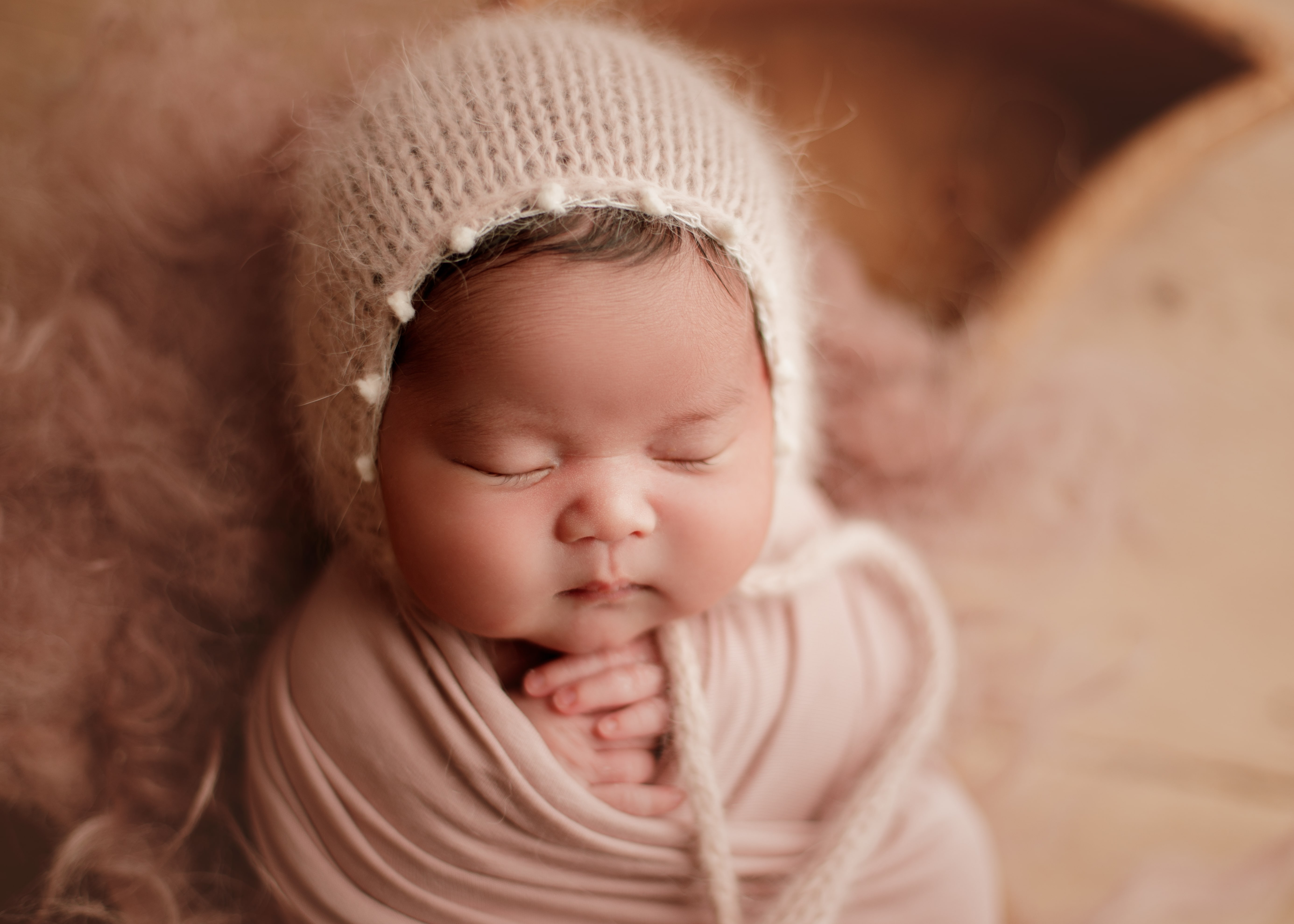 newborn baby girl sound asleep in Chicago newborn studio