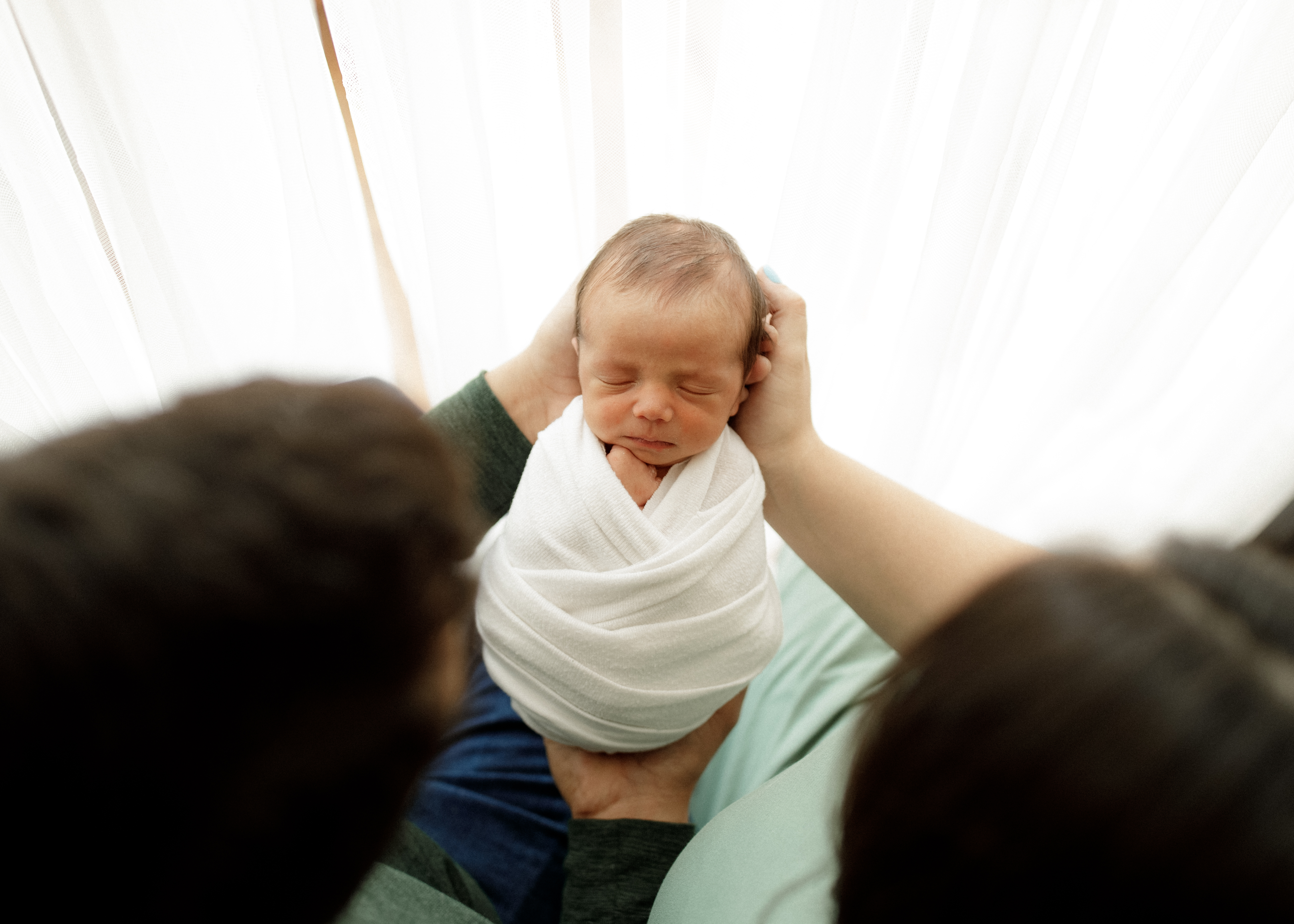 newborn pose with mom and dad